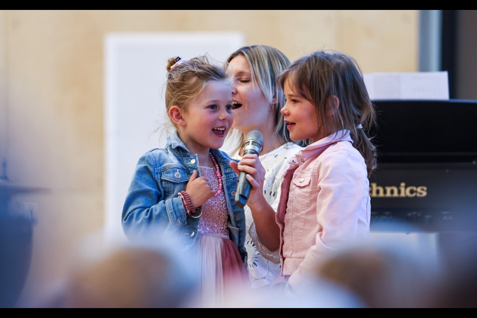 Betty Osler, left, and Florina Helie sing "Girl on Fire" during the second annual musical showcase at Banff Elementary School on Thursday (June 13). JUNGMIN HAM RMO PHOTO