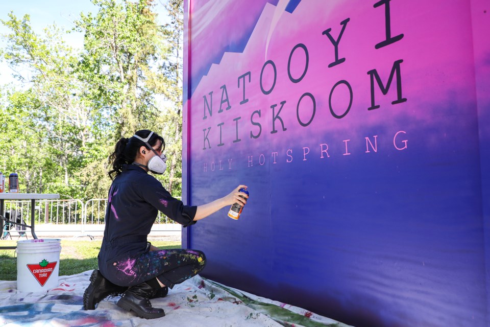 Kristy North Peigan from the Blackfoot Nation spray paints a mural at the Cave and Basin National Historic Site in Banff National Park on Friday (June 14). JUNGMIN HAM RMO PHOTO 