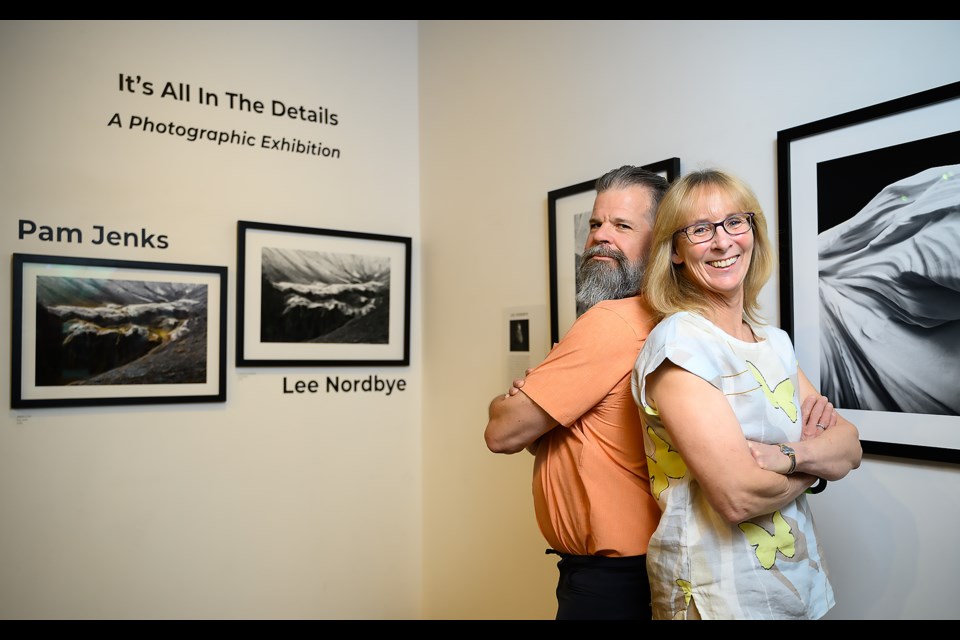 Lee Nordbye, left, and Pam Jenks pose for a photo at their exhibit, It's All In The Details, in Canmore at artsPlace on Monday (June 24). The exhibit will be open till July 28. MATTHEW THOMPSON RMO PHOTO