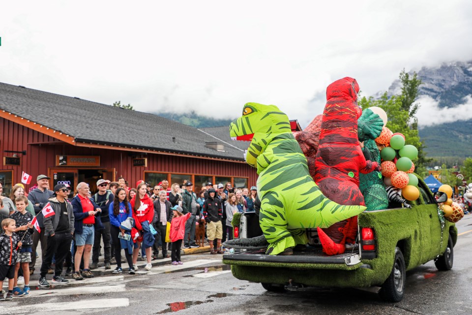 Pine & Pillar Landscaping Construction dinosaurs entertain the crowd for the Canada Day parade in Canmore on Monday (July 1).  JUNGMIN HAM RMO PHOTO 