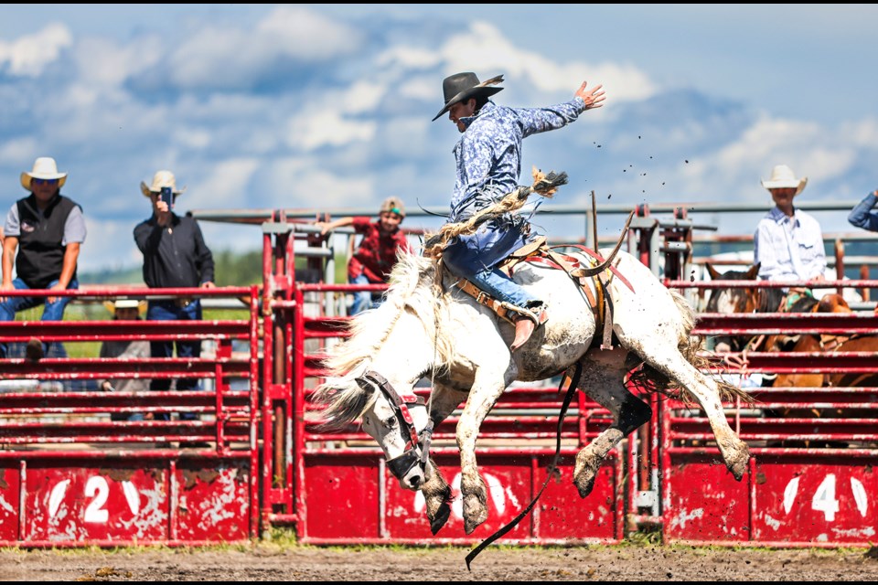 Hahots Shebala rides a bucking horse (bronco) for eight seconds in the saddle bronc riding during the Mînî Thnî Canada Day rodeo on Monday (July 1). JUNGMIN HAM RMO PHOTO 