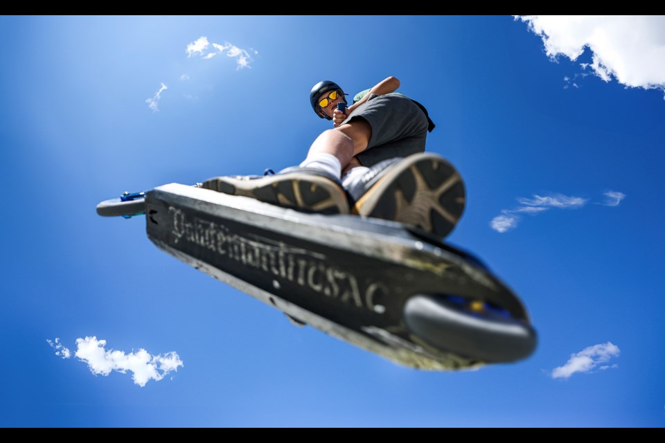 Anders Karlos catches air off a jump during the annual skatepark community barbecue hosted by BanffLIFE in Banff on Thursday (July 11). JUNGMIN HAM RMO PHOTO