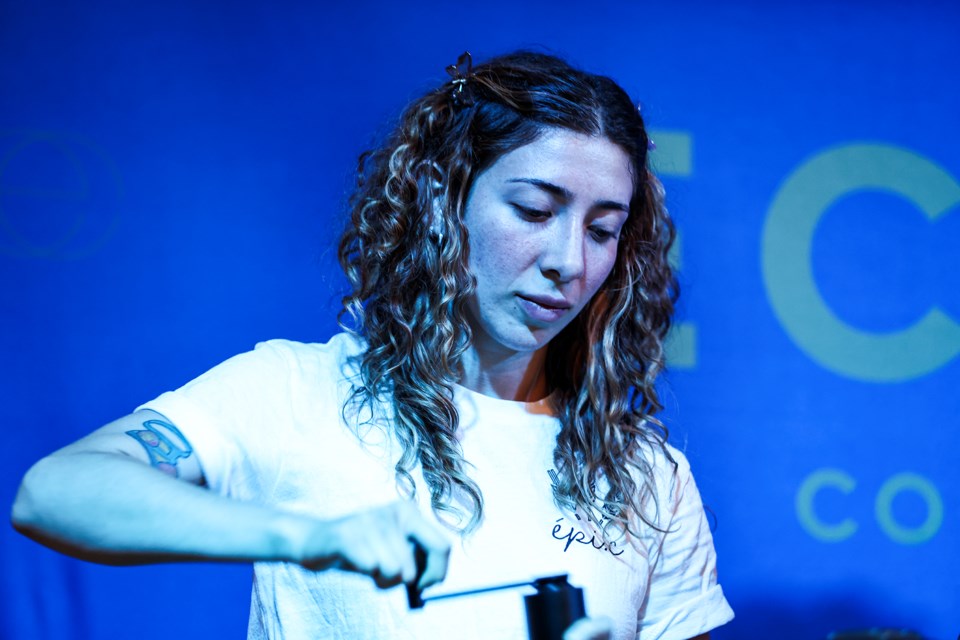 Ashley Moraga grinds coffee beans at the Canadian Aeropress Championship regional qualifier at Eclipse Coffee Roasters in Canmore on Saturday (July 13). JUNGMIN HAM RMO PHOTO