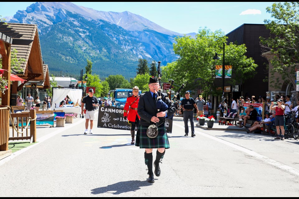 Miners' families head down Main Street for the Canmore Miners' Day parade on Saturday (July 13). This year marks the 45th anniversary after the mine closed in 1979. JUNGMIN HAM RMO PHOTO