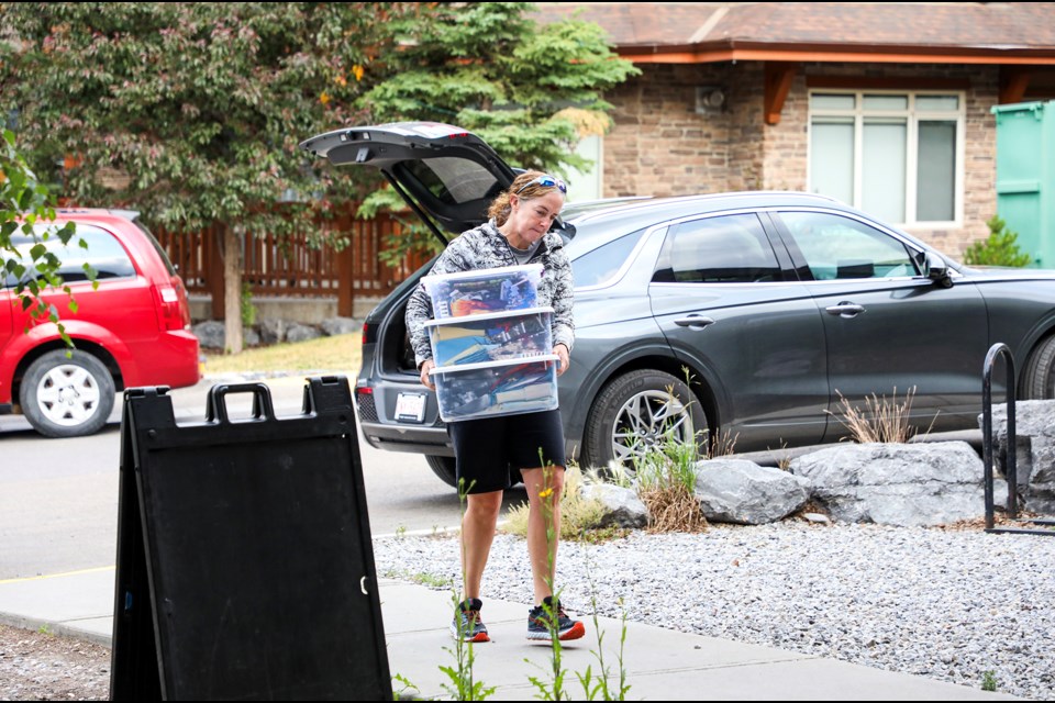 Canmore resident Stan Prenioslo donates three boxes of new clothes to support Jasper wildfire evacuees at 101B-56 Lincoln Park on Friday (July 26). JUNGMIN HAM RMO PHOTO