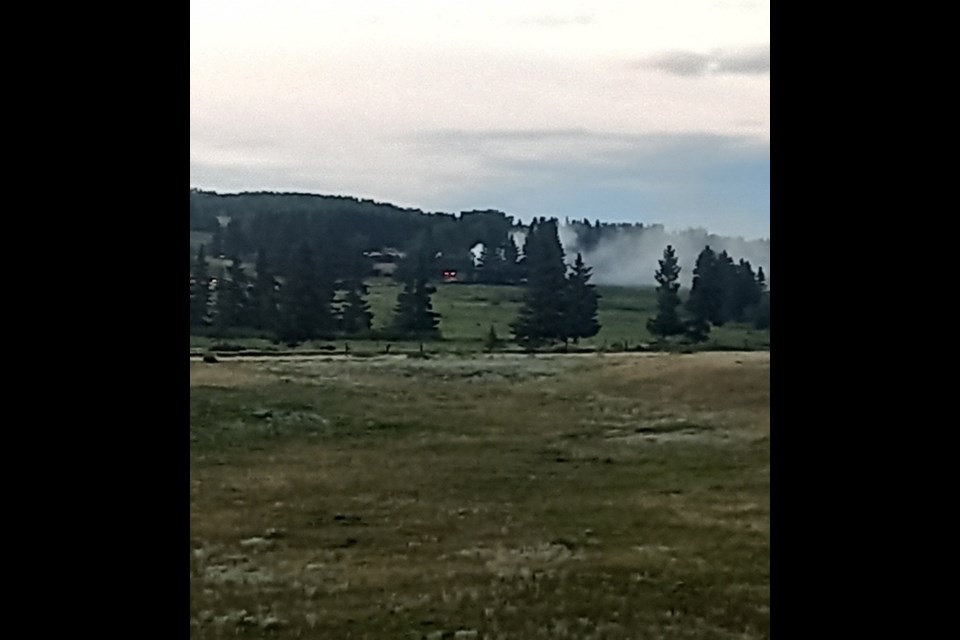 Smoke plumes from a fire at the Stoney Medicine Lodge as seen from the Highway 1A near Mînî Thnî on Îyârhe Nakoda First Nation Thursday evening (July 25).

PHOTO COURTESY OF KENNY HUNTER