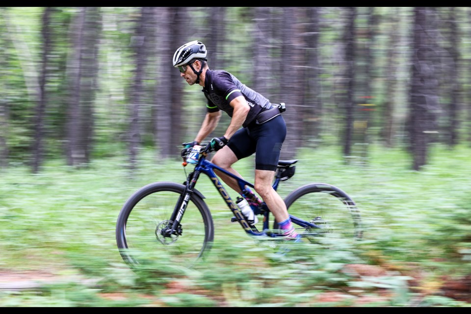 Thomas Lane rides on the trail during the 24-hour mountain bike race Canadian Rockies 24 at the Canmore Nordic Centre on Saturday (July 27). JUNGMIN HAM RMO PHOTO 