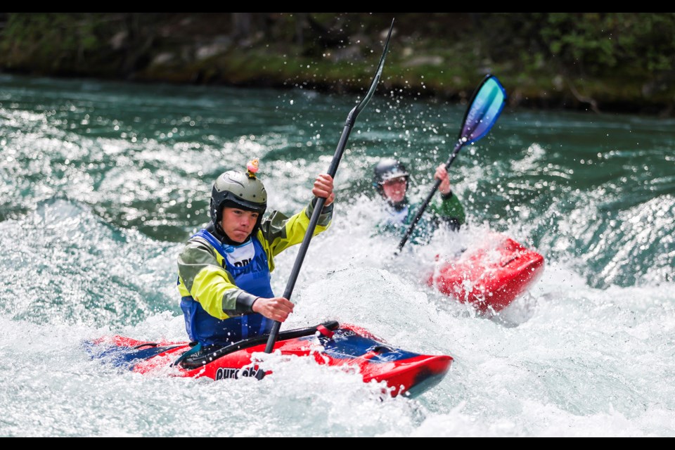 Jordy Munro, left, and Tanner Clark compete during the kayak-cross event at the 2024 National Whitewater Championships in Kananaskis on Thursday (Aug. 15). JUNGMIN HAM RMO PHOTO