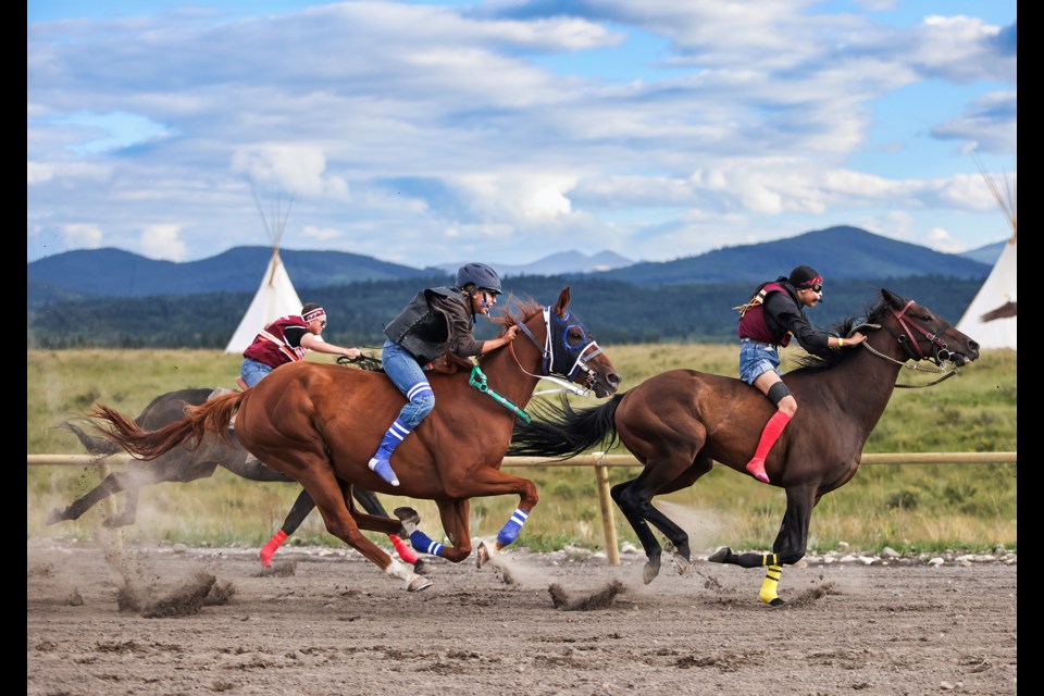 Riders compete during the Lady Warrior race at the second annual Mînî Thnî Indian Relay Race at the racetrack near Goodstoney Rodeo Centre in Îyârhe (Stoney) Nakoda First Nation on Saturday (Aug. 17). The Lady Warrior race is a chance for women to showcase their skills in a one-lap bareback race around the track. JUNGMIN HAM RMO PHOTO