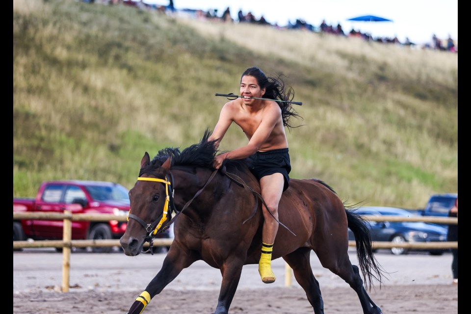 Stoney Express team's Ethan Houle rides a horse bareback at the second annual Mînî Thnî Indian Relay Race at the racetrack near Goodstoney Rodeo Centre in Îyârhe (Stoney) Nakoda First Nation on Saturday (Aug. 17). JUNGMIN HAM RMO PHOTO