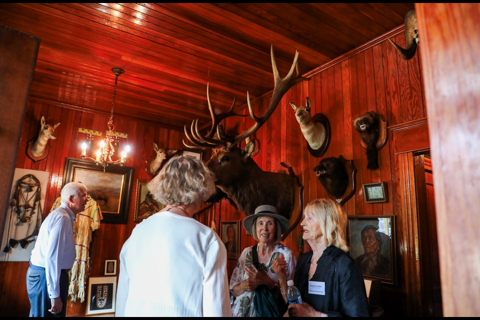 Art lovers appreciate artifacts during the Eleanor Luxton Historical Foundation annual garden party at the Historic Luxton Museum in Banff National Park on Friday (Aug. 23).  JUNGMIN HAM RMO PHOTO 