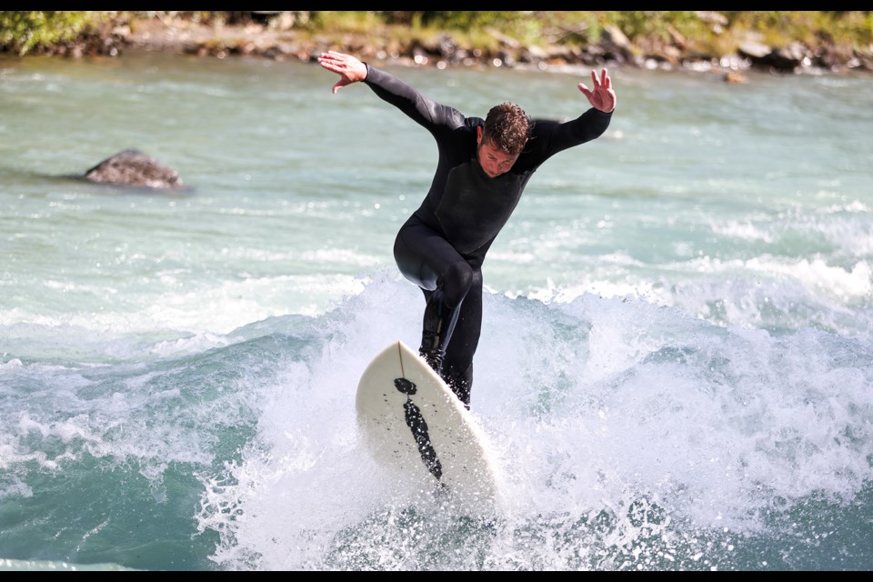 Tyler Miller crashed through a wave in the Mountain Wave Classic annual surf competition in Kananaskis Country on Saturday (Aug. 24). JUNGMIN HAM RMO PHOTO 