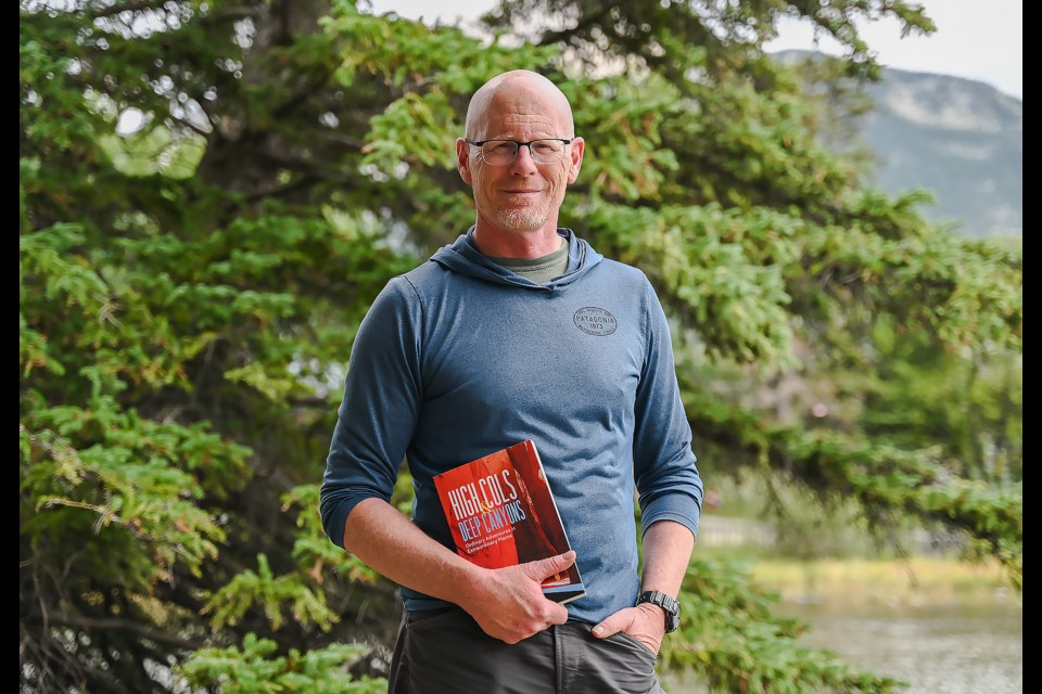 Canmore's Stephen Legault poses for a portrait in Canmore on Sunday (Aug. 25) with his new book "High Cols and Deep Canyons: Ordinary Adventures in Extraordinary Places". MATTHEW THOMPSON RMO PHOTO