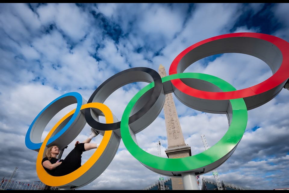 Kelly VanderBeek lounging in the Olympic rings in Paris. SUBMITTED PHOTO