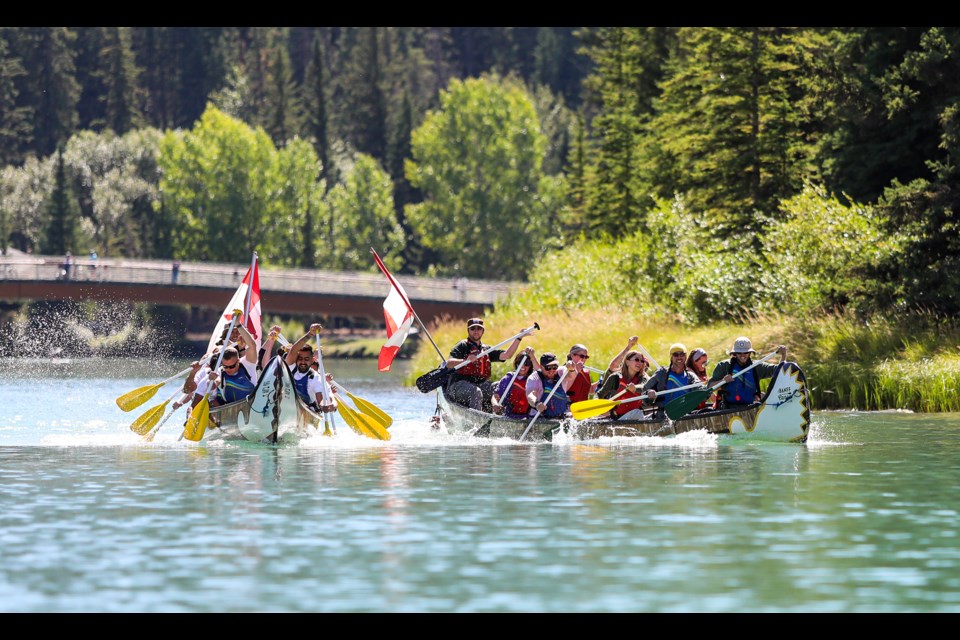 Arctos & Bird Loons, left, and Banff & Lake Louise Tourism compete during the annual fundraiser Canoe for a Cause 2024 in Banff National Park on Thursday (Aug. 29). JUNGMIN HAM RMO PHOTO