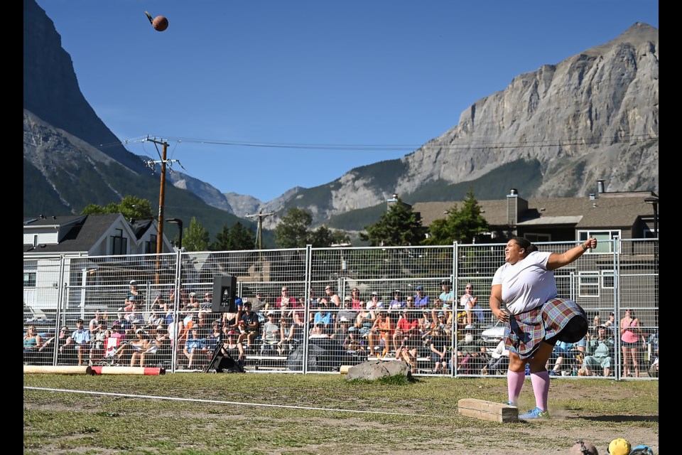 Alexis Johnson launches a 28 lbs. stone weight to set a new Canadian record of 45 feet and five inches in the Heavy Games competition at the 33rd Canmore Highland Games on Sunday (Sept. 1). MATTHEW THOMPSON RMO PHOTO