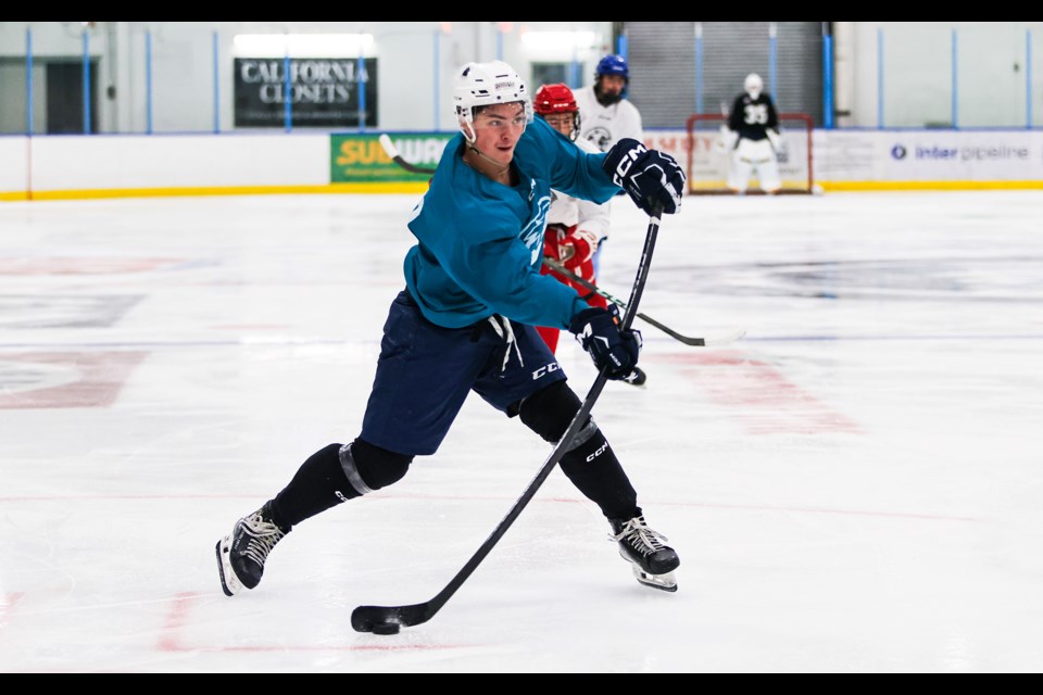 Team Michalsky's Bryson Insinger blasts a shot on net during the Canmore Eagles training camp inter-squad game at the Canmore Recreation Centre on Tuesday (Sept. 3). JUNGMIN HAM RMO PHOTO