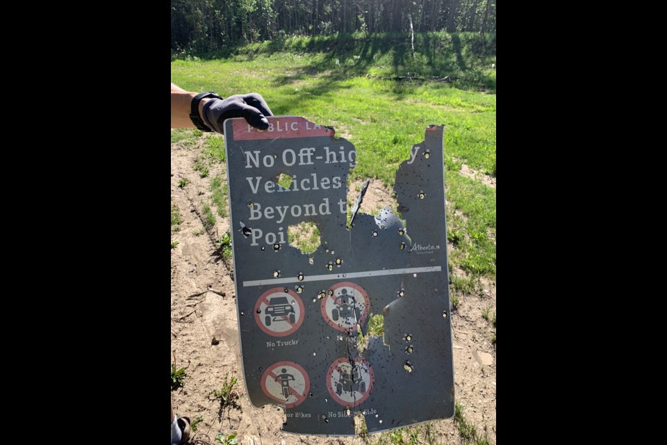 A shot up sign in the Ghost Public Land Use Zone.
PHOTO COURTESY OF GHOST WATERSHED ALLIANCE SOCIETY