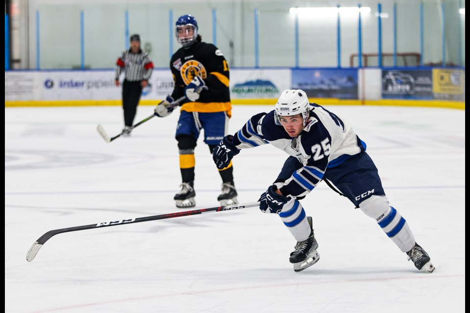 Canmore Eagles forward Owen Jones races for the puck against the Olds Grizzlys during a preseason game at the Canmore Recreation Centre on Friday (Sept. 6). The Eagles won 6-3. JUNGMIN HAM RMO PHOTO