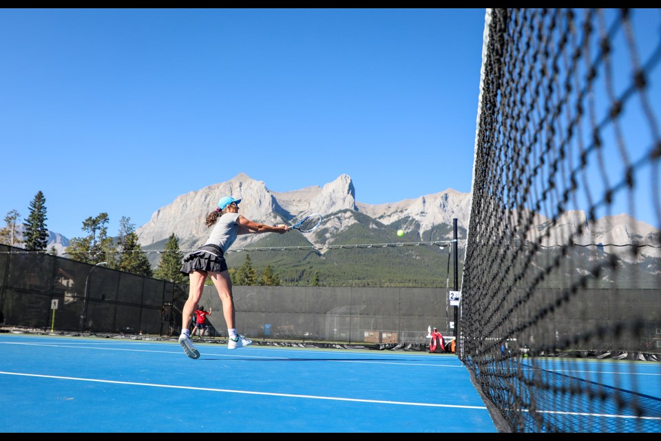 Anne Walton smacks a backhand shot during the Canmore Tennis Association’s women doubles championship match at Lions Park in Canmore on Saturday (Sept. 7). JUNGMIN HAM RMO PHOTO