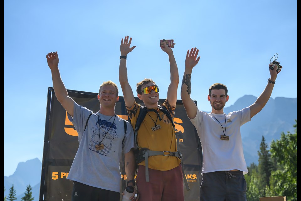 The top trail runner of the 19.8km grit distance, Peter Clack celebrates with Samuel Roy, second, and Andrew Thomas, third, at the Canmore 5 Peaks trail race at the Canmore Nordic Centre on Saturday (Sept. 7). MATTHEW THOMPSON RMO PHOTO