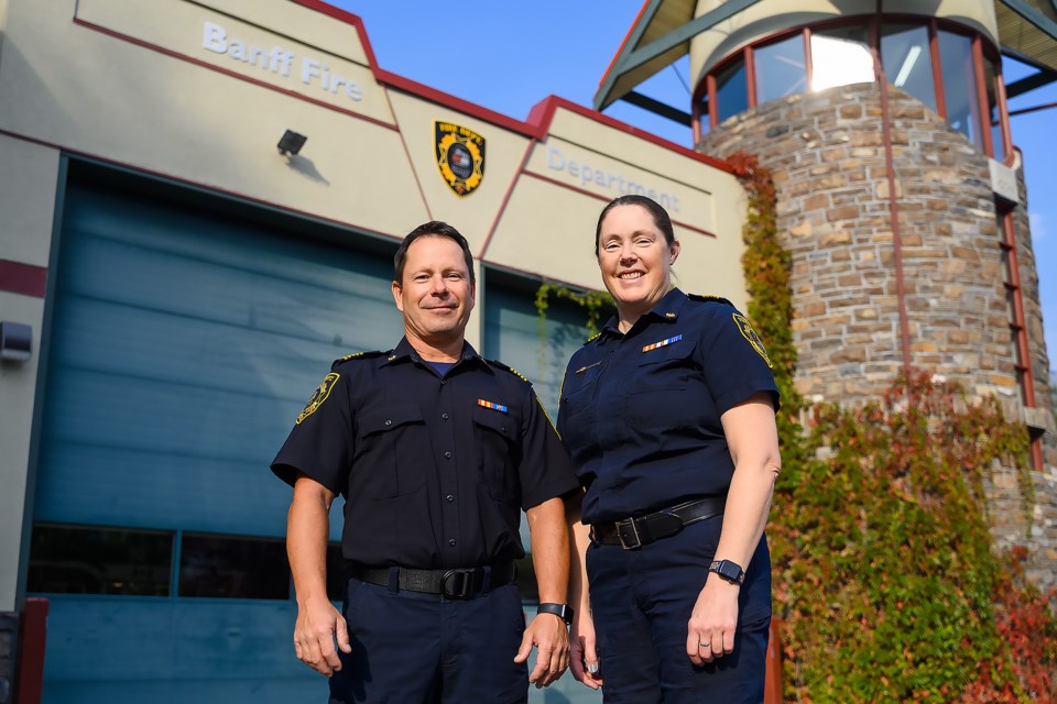 Banff Fire Department's former fire chief Russ Geyer, left, is pictured alongside new fire chief Keri Martens in Banff on Monday (Sept. 9). MATTHEW THOMPSON RMO PHOTO