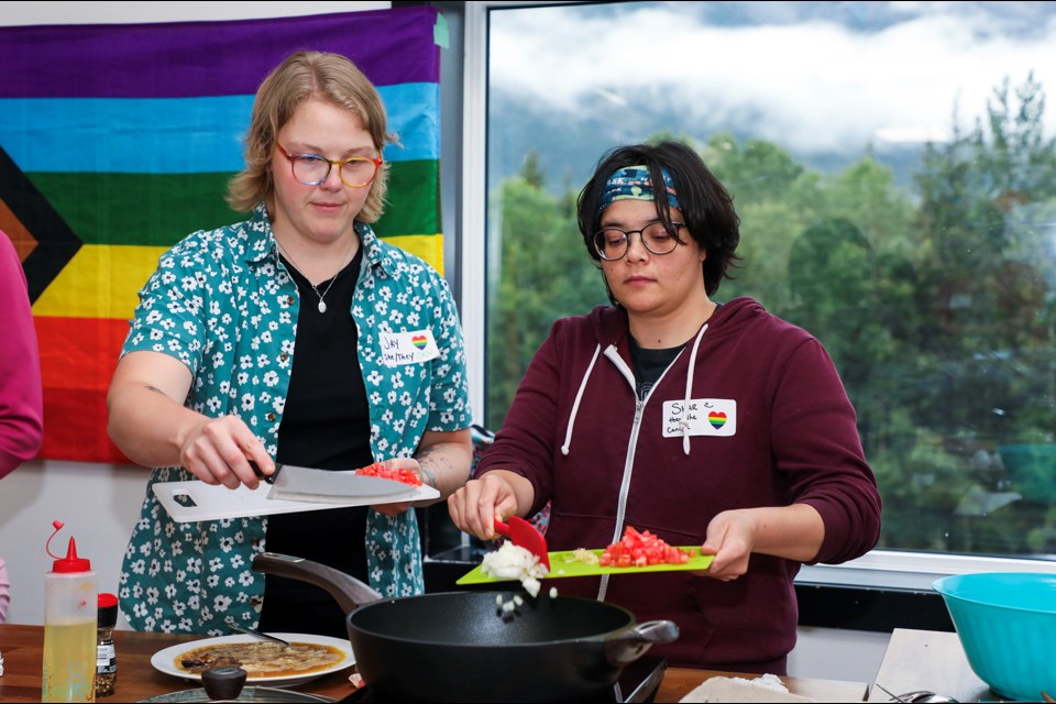 Jenna Wray, left, and Shar Wray make tortang talong, a Filipino eggplant omelette during the "Cooking Together: Sharing Culture Through Food" event hosted by CCIS (temporary foreign worker support), Settlement Services, Ethio Care and Canmore Pride at The Co+Kitchen in Canmore on Thursday (Sept. 12). JUNGMIN HAM RMO PHOTO