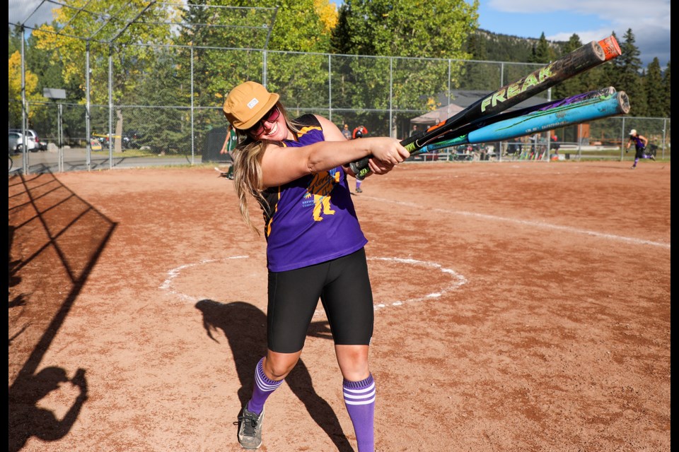 Team Chuggers Michelle Monk warms up by swinging four bats at once. The Chuggers were up against Team Tommy's during the Banff Wild Rose Women's Slo Pitch League playoffs final at the Banff Recreation Grounds on Saturday (Sept. 14). The Chuggers won 22-5. JUNGMIN HAM RMO PHOTO 