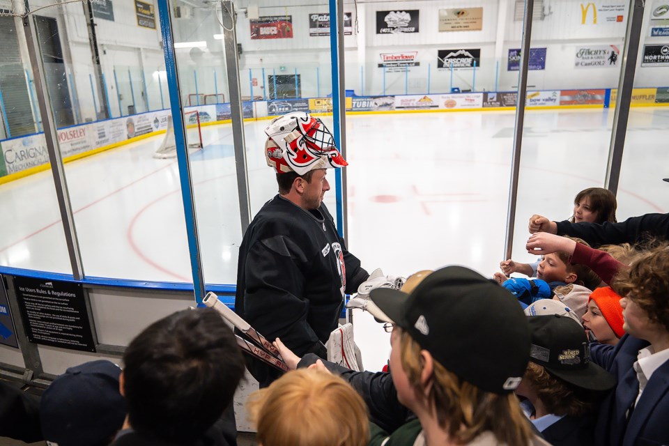 With hockey fans waiting, the New Jersey Devils' goalie Jake Allen walks onto the ice during a practice at the Canmore Recreation Centre on Sunday (Nov. 3). The Devils played the Calgary Flames on Friday, losing 3-0, and take on the Edmonton Oilers Monday (Nov. 4). MATTHEW THOMPSON RMO PHOTO