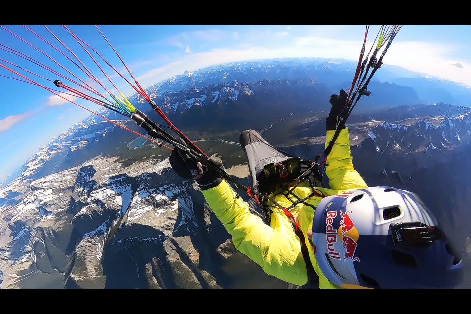 Will Gadd flying his paraglider around Ha Ling peak before setting off toward Mount Assiniboine. SUBMITTED PHOTO