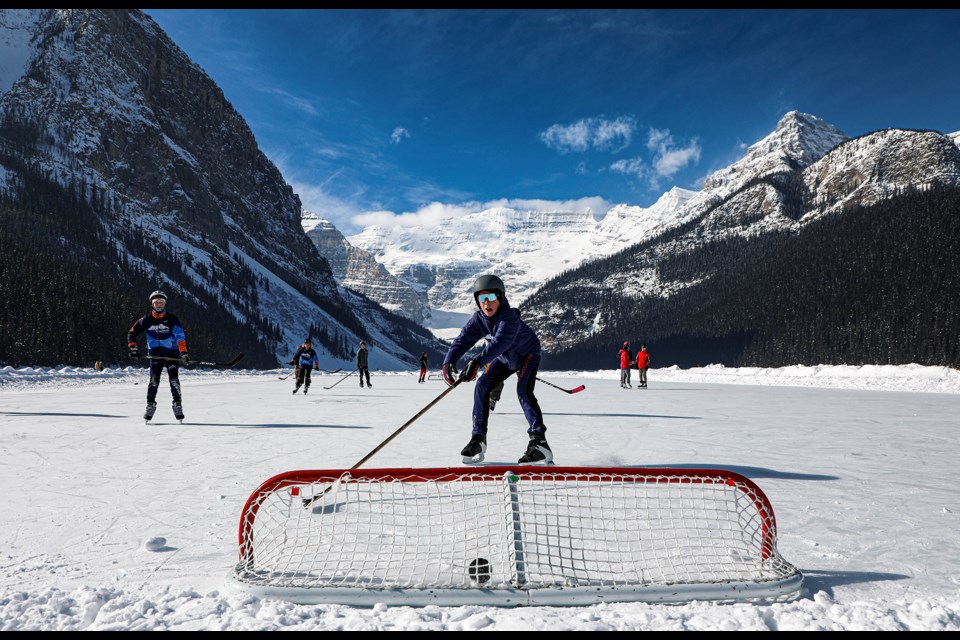 Foothills Nordic's Matthias Frank, right, plays the hockey game through the Canada sports friendship exchange program at the frozen Lake Louise on Thursday (March 9). JUNGMIN HAM RMO PHOTO
