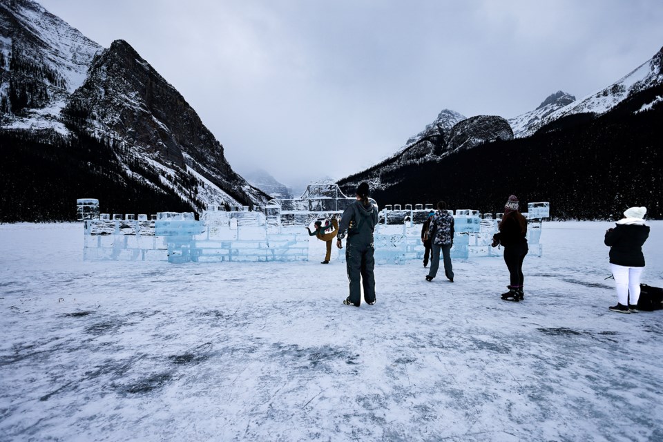 People take pictures in front of the ice castle at Lake Louise on Thursday (Jan. 30). JUNGMIN HAM RMO PHOTO