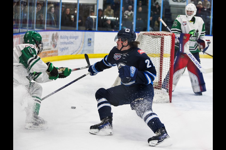 Canmore Eagles Nathan MacPherson-Ridgewell scuffles with Drayton Valley Thunder Tafari Chingwaru at the Canmore Recreation Centre on Friday (Feb. 28). The Eagles beat the Thunder 7-0. JUNGMIN HAM RMO PHOTO