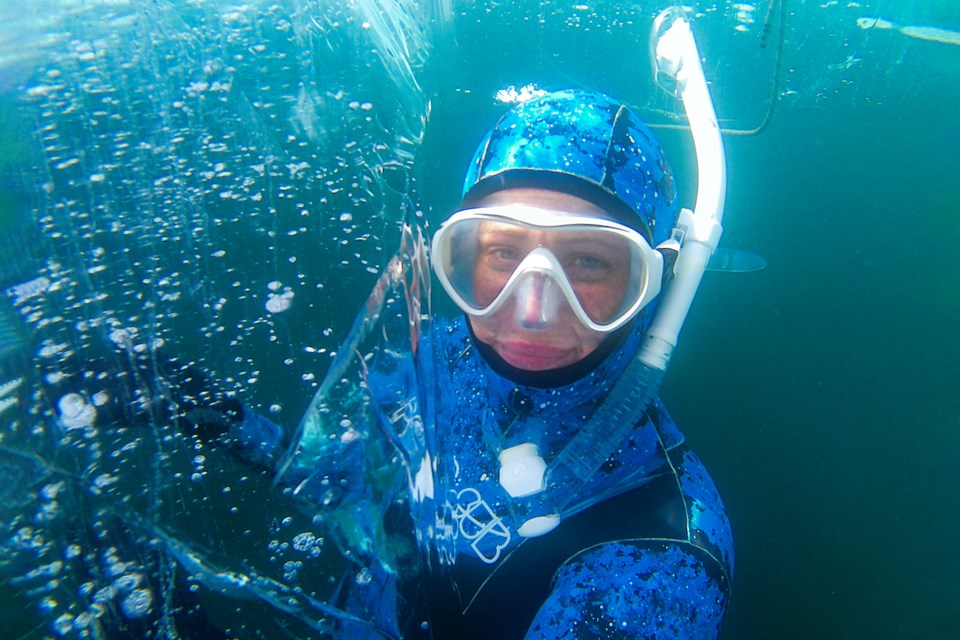 Kasia Habermeyer goes freediving under the ice at Lake Minnewanka in Banff National Park on Saturday (March 8). JUNGMIN HAM RMO PHOTO