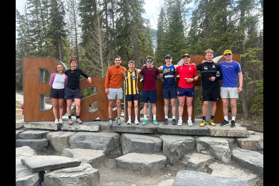 Runners take a photo at the Banff sign before running up Mount Norquay  as part of the fundraiser for Banff Food Rescue. SUBMITTED PHOTO