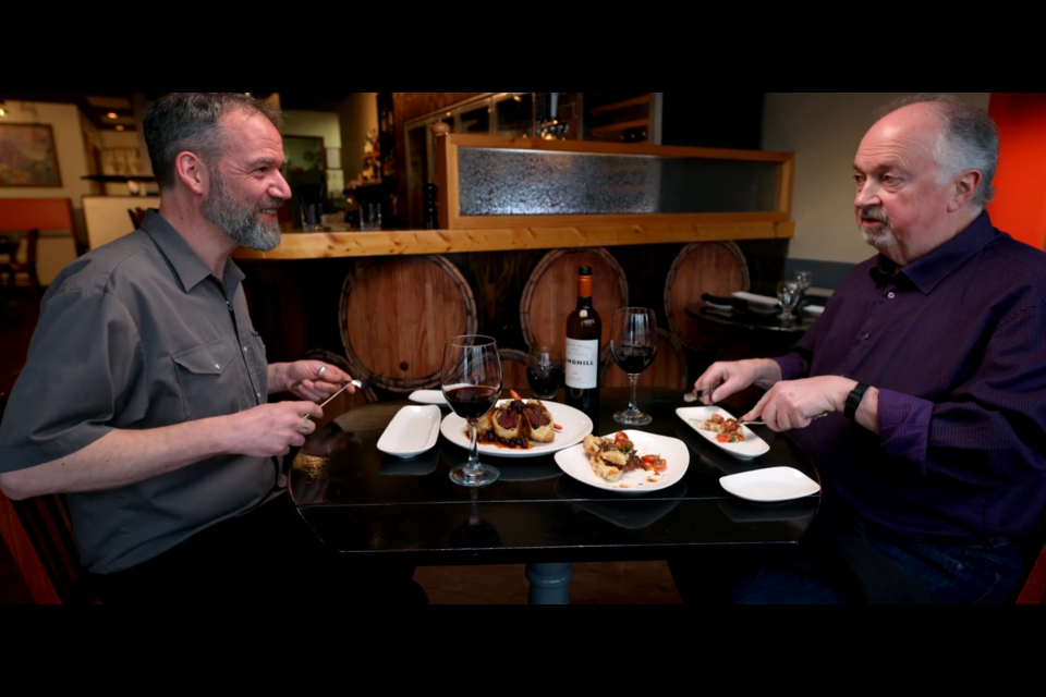 Cuisine of the Rockies host John Gilchrist, right, with owner and chef Jason Munn of Syrahs of Jasper, prior to the wildfire. SUBMITTED PHOTO