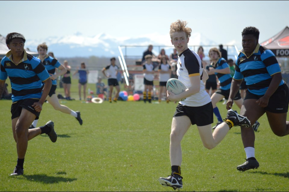 Banff Bears' Dean Dickson stretches his legs against the All Saints Bobcats at the Clearwater Cup high school 7s tournament at Calgary Rugby Union between May 10-11. The Banff senior boys won two games on the consolation bracket. JORDAN SMALL RMO PHOTO