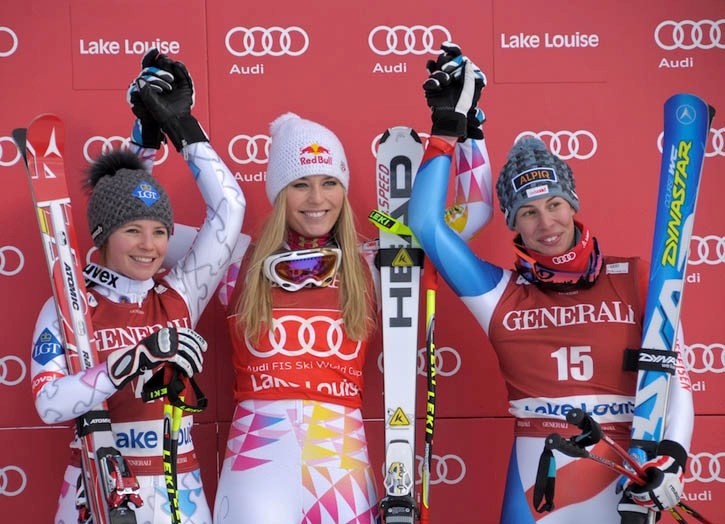 Lindsey Vonn (centre) celebrates with Tina Weirather and Dominique Gisin.