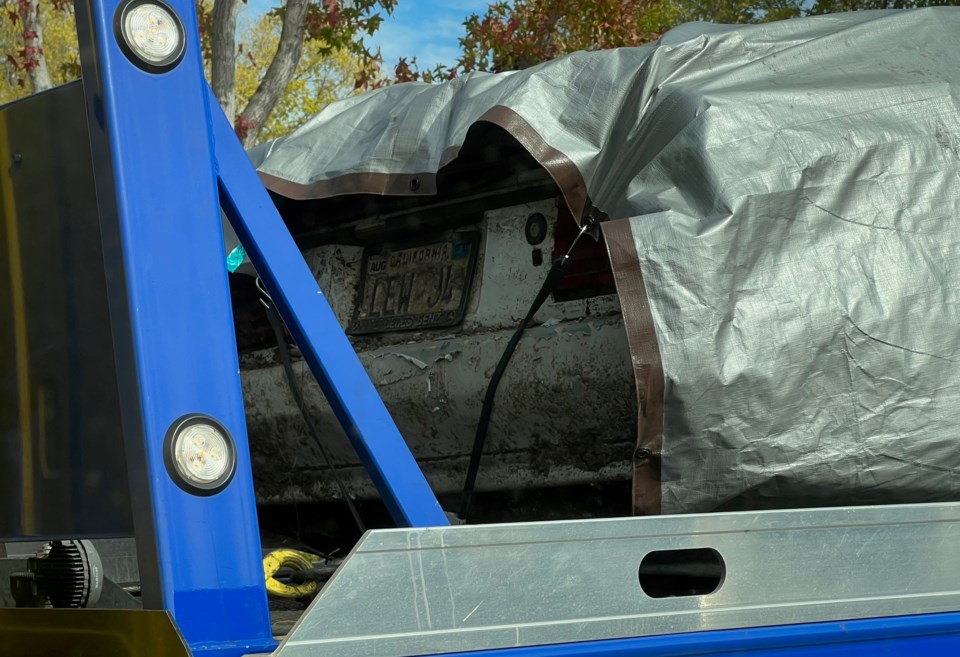 Buried car Forensics team analyzing vehicle for DNA that could connect