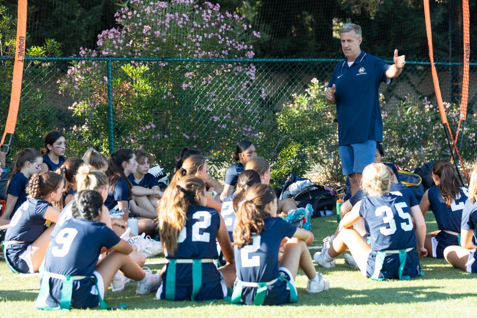 Steve Young has 'full circle' moment as girls flag football coach