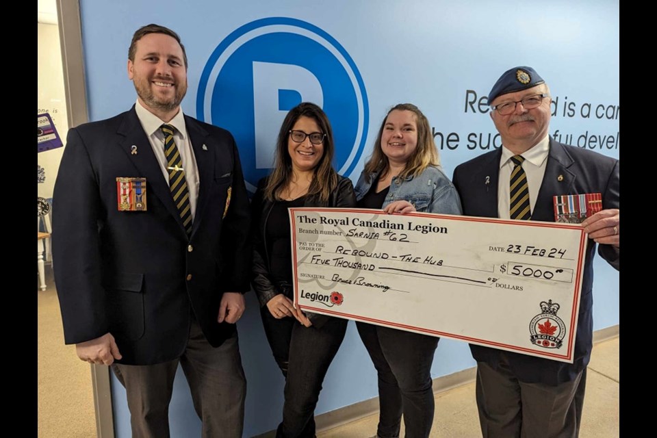 The Sarnia Legion Branch 62 recently made a $5,000 donation to The Hub, at Sarnia-Lambton Rebound. Pictured are: (from left) Ron Realesmith, President of Legion, Meghan Realesmith, President of Rebound, Kristen Clendenning, Hub Supervisor, and Bruce Browning, Community Services Officer. 
