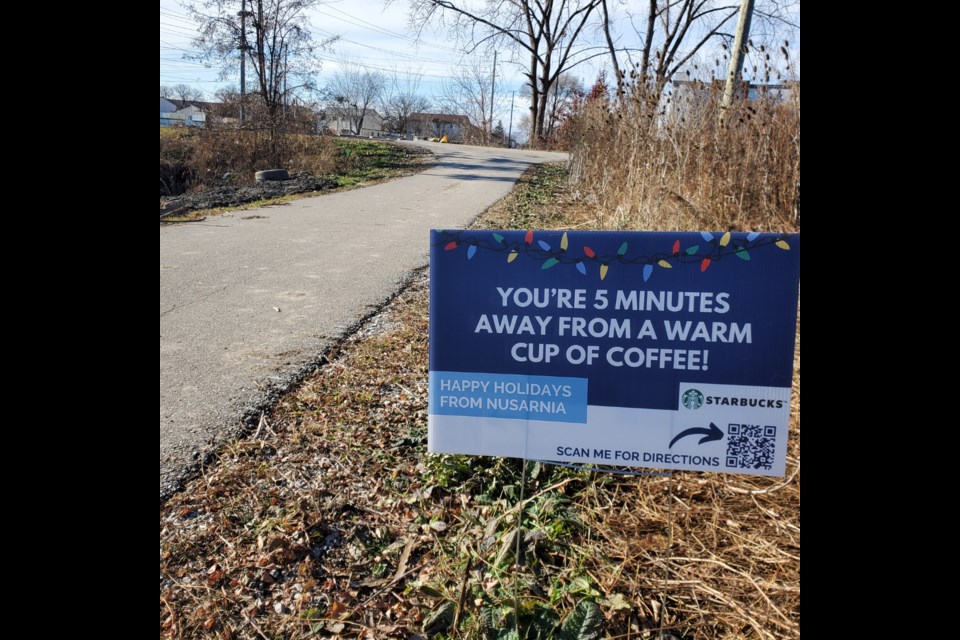 The folks at nuSarnia have placed signs along the Midtown Trail (the multi-use path behind the International Plaza, Sarnia Centre, and Sarnia Square along London Road) encouraging neighbours to walk and shop the city.