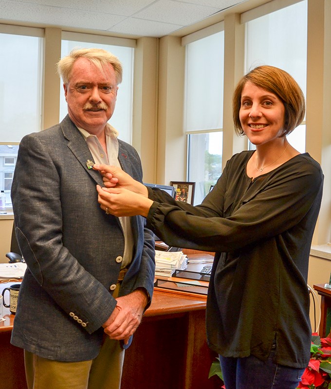 Emily Potter of the Sarnia Historical Society pins one of the Vimy Pins on Sarnia Mayor Mike Bradley. Submitted Photo