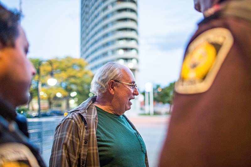 A man voices his concerns with Sarnia Police after they escort him from Sarnia City Hall on Monday night. The ejection followed repeated interruptions during the city council meeting. Troy Shantz