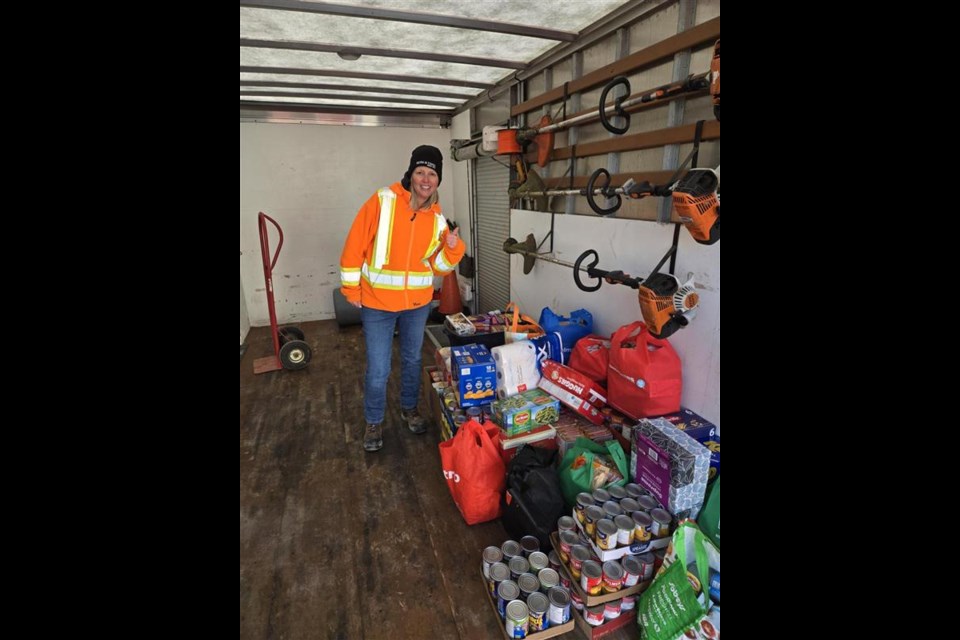 Katie Ayrheart unloading the donations for the Inn.