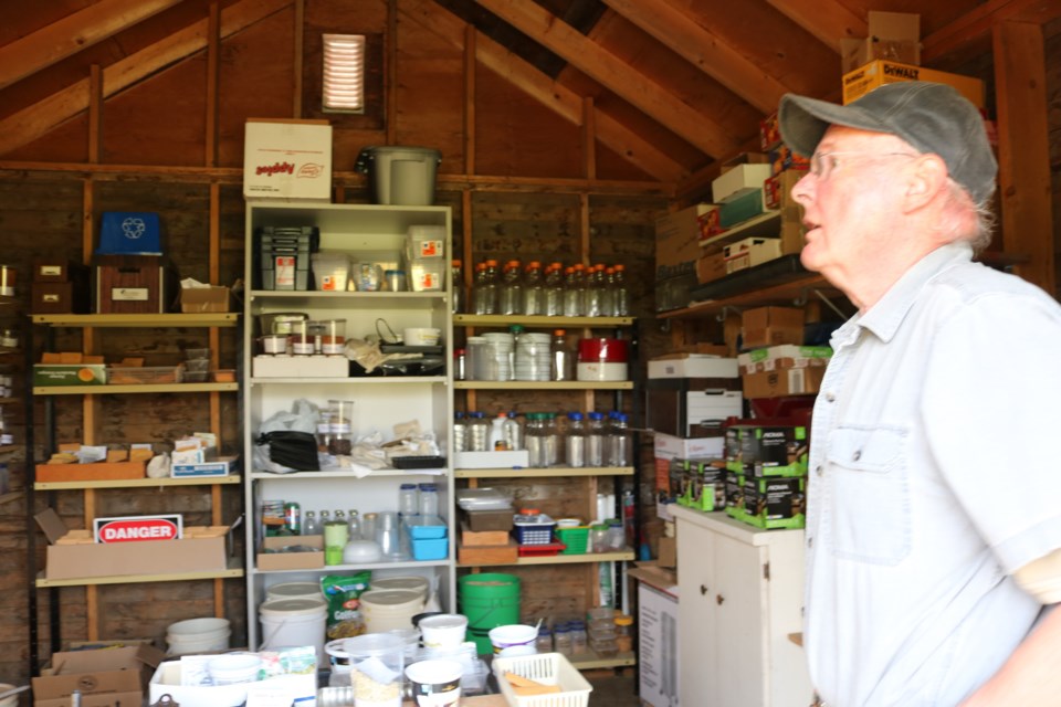 Warren Crossman in his seed shed where his many varieties of beans are stored.