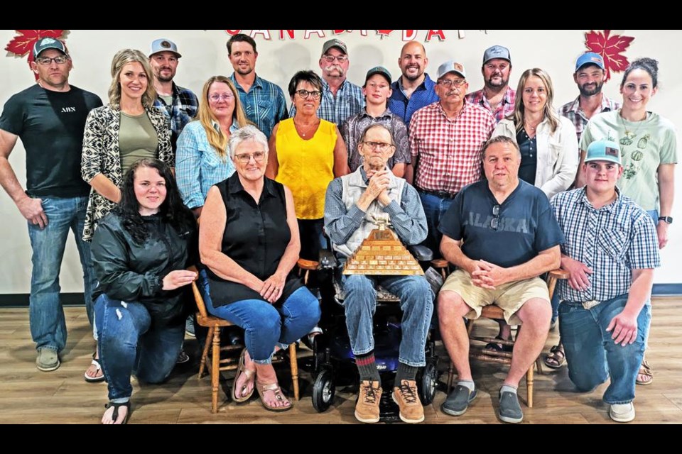 Several past recipients of the Edgar May Trophy for the Grand Champion steer of the Cymri 4-H Beef Club met together with the name sake, Edgar May, at the Parkway Lodge in Weyburn on Wednesday evening. In the back row from left are Colin Rosengren, Josh Gustafson, Benji Gustafson, Glenn Wiens, Rodney Gill, Daryl Carlson and Ryan Vandenhurk; in the middle row are Becca Anderson (Gustafson), Pauline Ziehl Grimsrud, Brenda Connelly, Carter Wilgenbusch, Cliff Gallinger, Kendall Eggum (Emde) and Kassidy Fellner (Sjostrand), and in front are Dakota Dreher (Emde), Rhonda Martinson (Emde), Edgar May (holding the trophy), Brad Eggum and Brylan Rasmuson.