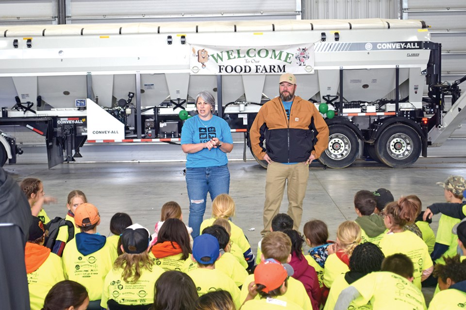 Jennifer and Jordan Lindgren, hosts of the Lindgren Seeds Food Farm introduced and instructed children from the various area schools on how the Food Farm event would go.