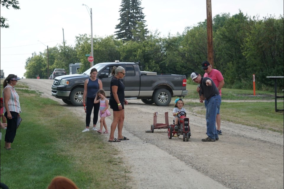 Pascal Valliere tested a pedal tractor ahead of the kids' tractor pull during the Frobisher Threshermen's Reunion on Sunday.