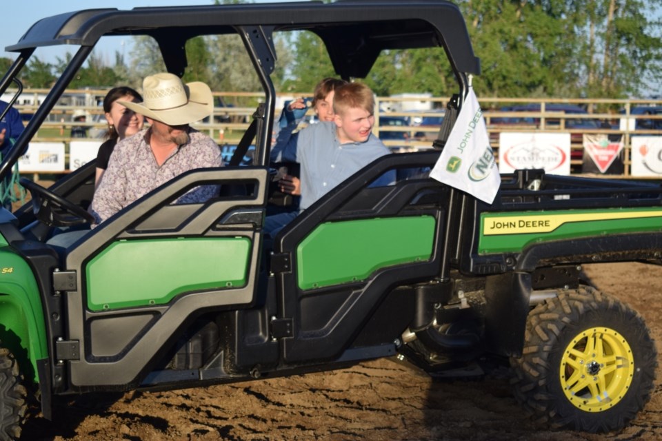 Jaycee Ross, right, donated his 4--H steer to raise money for the MRI campaign. 